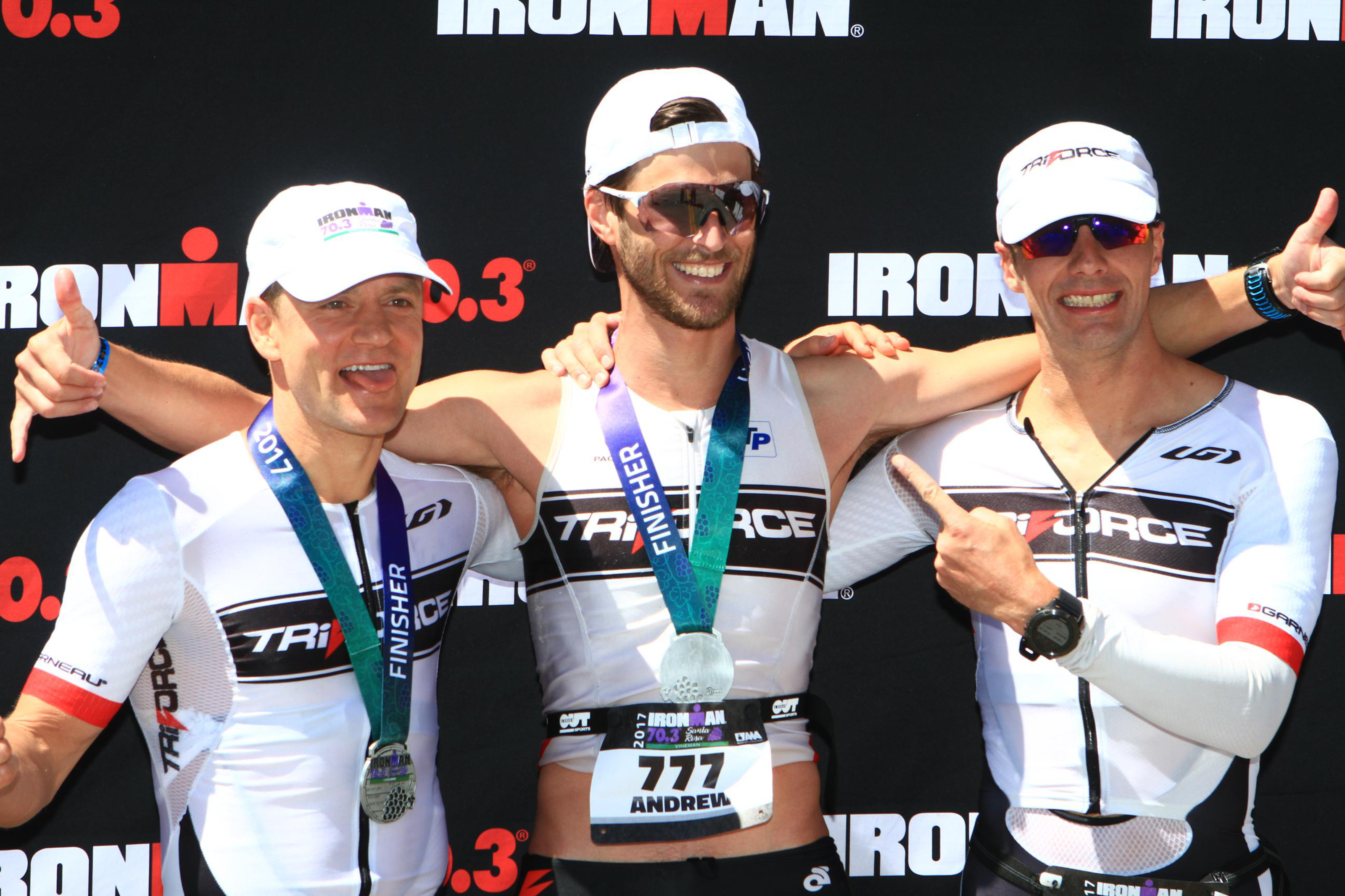 Ironman 70.3 podium photo with TriForce teammates